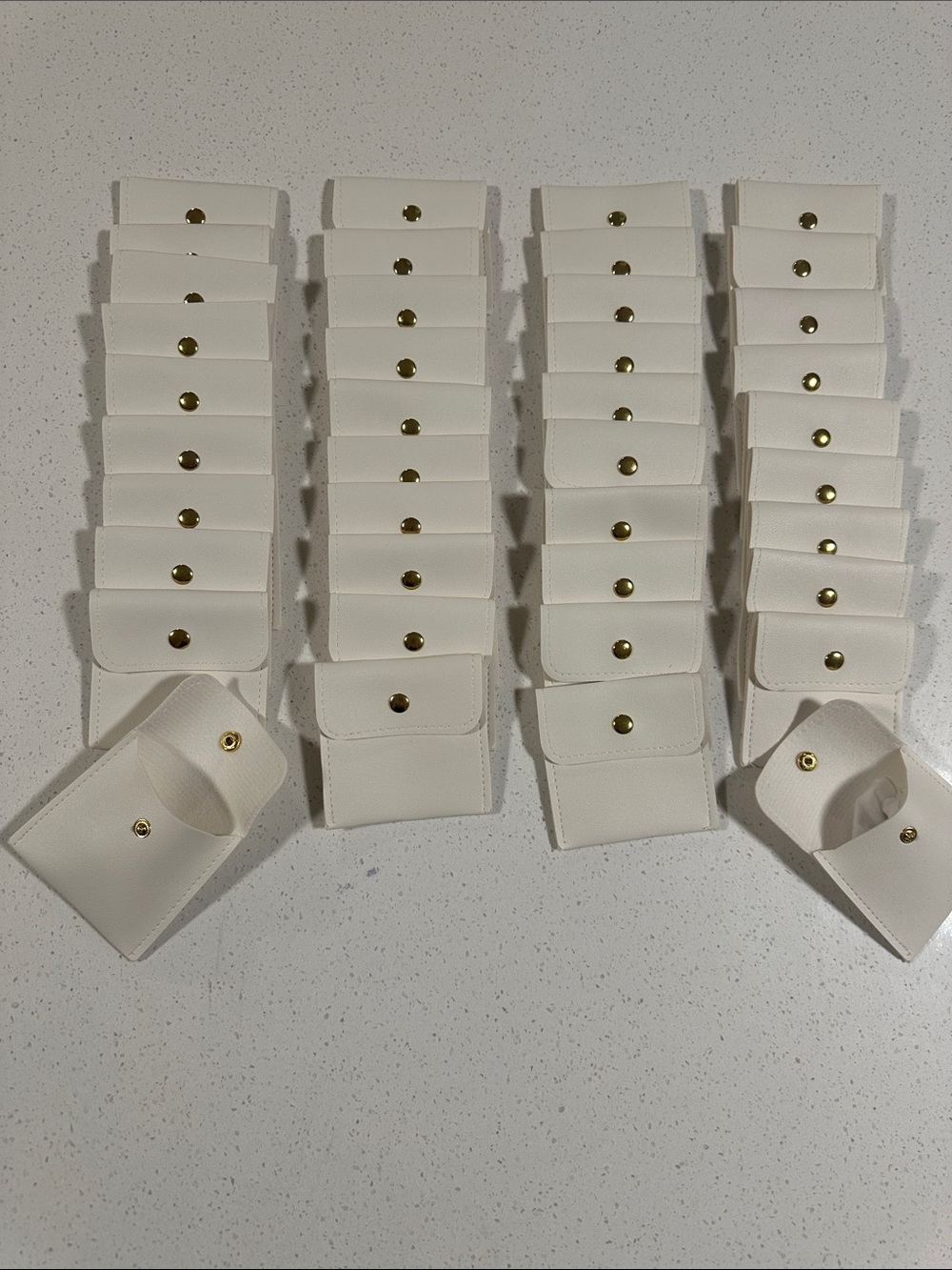 Collection of 40 Ivory Faux Leather Mini Jewelry, Coins, Hair Clips Storage Bags